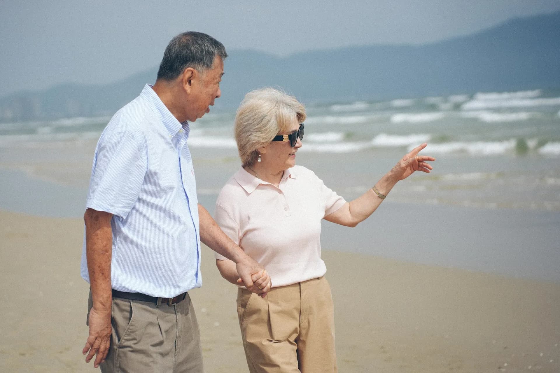 An active adult walking outdoors in natural light.